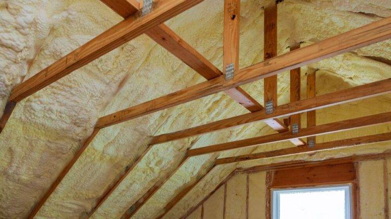 Attic with foam insulation applied by Affordable Heating and Air, a professional insulation company in LA County, showcasing high-quality insulation services for energy efficiency.
