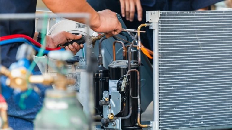 Affordable Heating and Air technician repairing an air conditioning unit during an HVAC repair in Woodland Hills, CA.