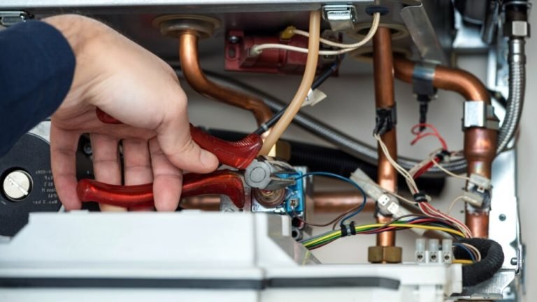 Affordable Heating and Air technician repairing furnace copper tubing during an emergency furnace repair service in Woodland Hills.