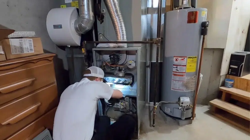 An affordable heating and air technician performs an air conditioning check-up at a residential property in West Hollywood as part of AC annual maintenance.