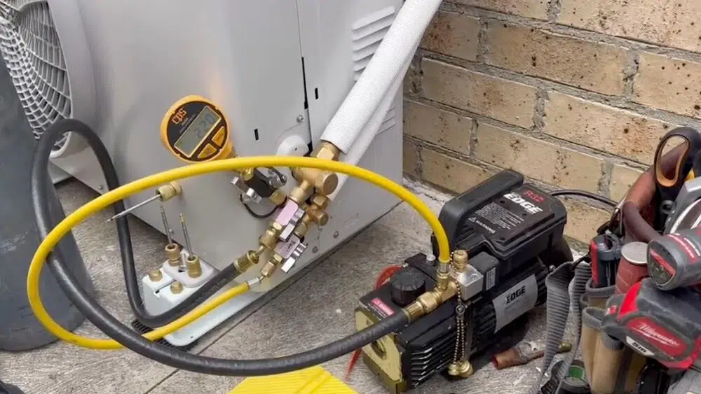 HVAC maintenance tools and gauges connected to an outdoor unit in Beverly Hills, CA, for a routine performance check.