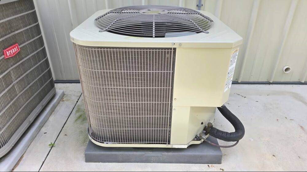 Outdoor central air conditioning unit being inspected during Air Conditioning Repair Santa Clarita service.
