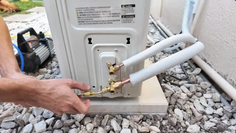 Close-up of copper refrigerant lines being connected during a ductless AC installation in Santa Clarita, CA.