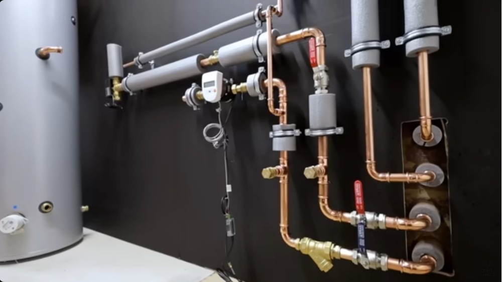 Heat pump repair Santa Clarita showing detailed copper piping connections and valve fittings during maintenance service.