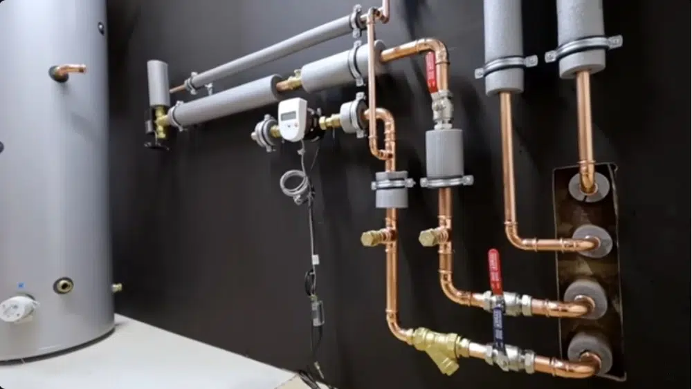 Heat pump repair Santa Clarita showing detailed copper piping connections and valve fittings during maintenance service.