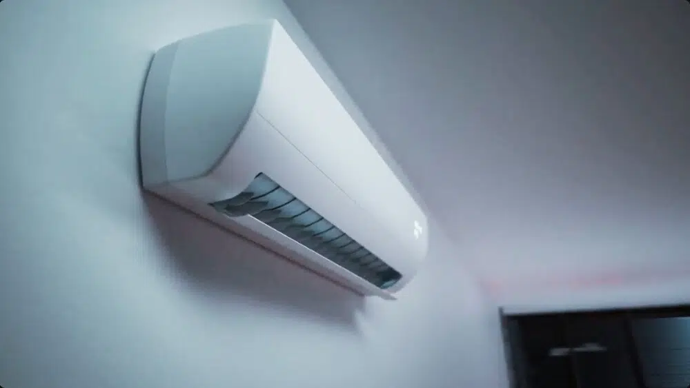 Immediate HVAC technician performing maintenance on a wall-mounted indoor air conditioner, illustrating HVAC repair Santa Monica solutions.