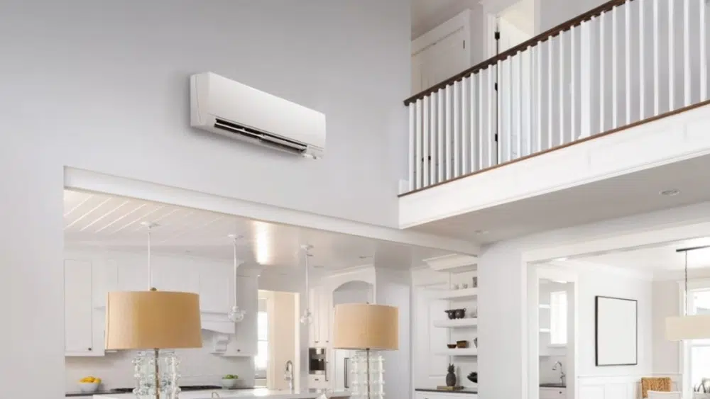 Interior view of a living room with a ductless mini split AC unit installed high on the wall in Santa Clarita, CA.