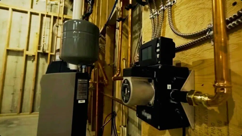 A certified HVAC technician handling repair work on a water heater in Santa Monica.