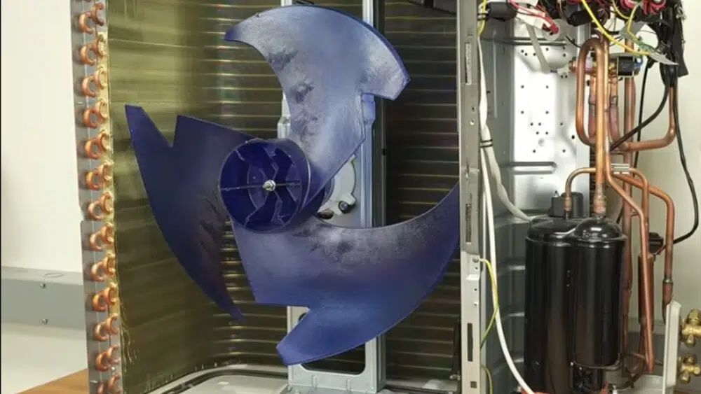Close-up view of a blue fan inside an HVAC unit, illustrating professional heat pump service and repair in Santa Monica, CA