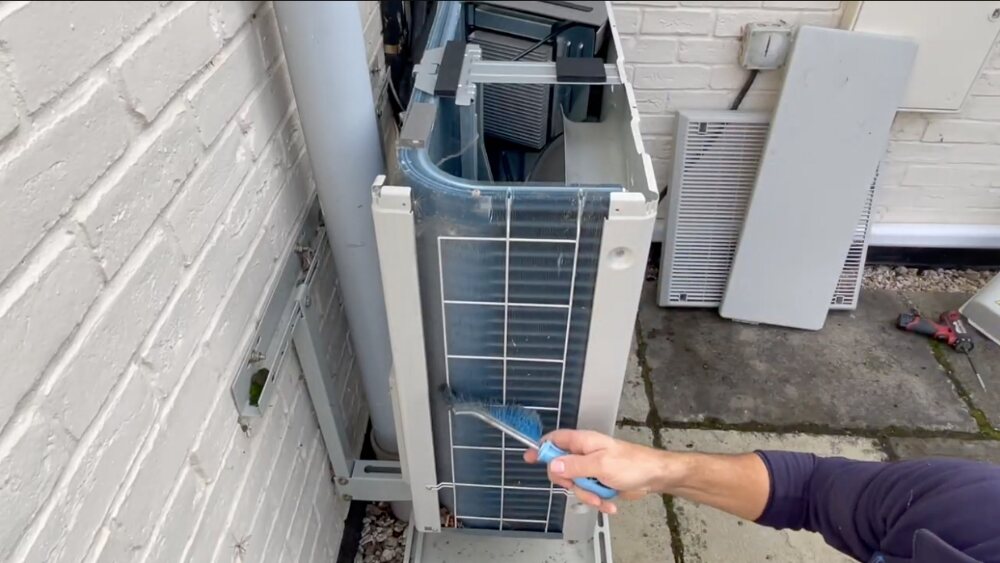 Heating system maintenance with coil cleaning on an outdoor unit in Los Angeles County.