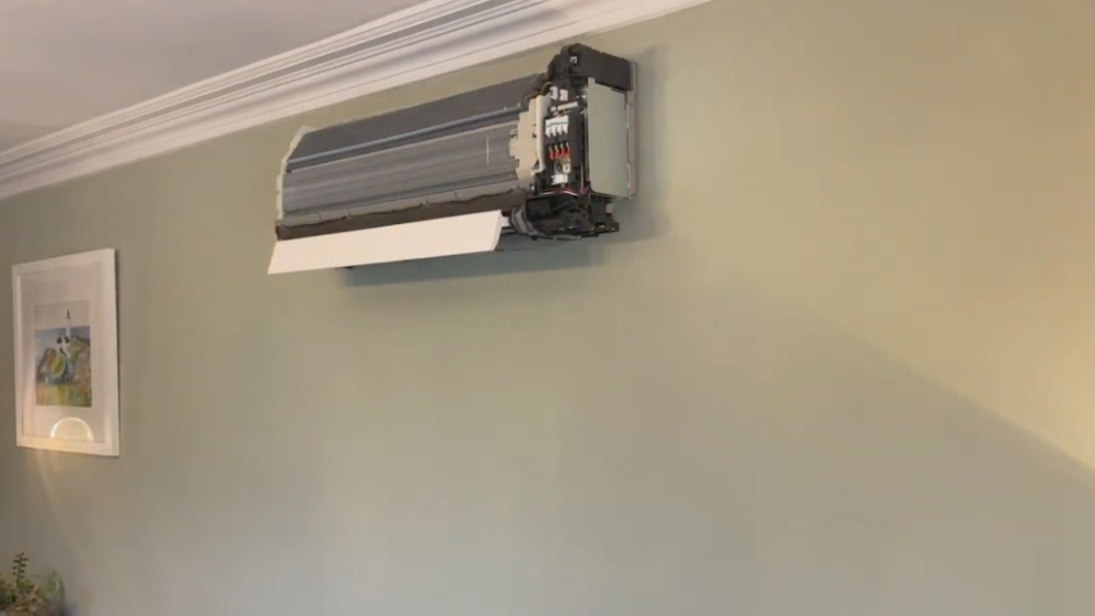 Technician performing Heating Tune-Up on a ductless indoor unit in Los Angeles County.