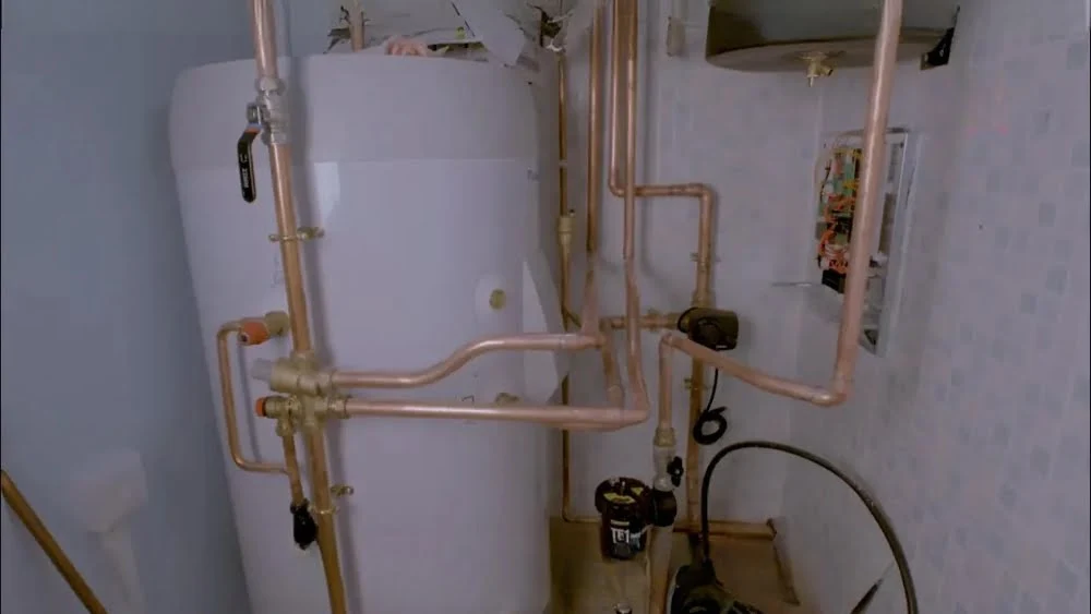 Technicians and certified heat pump installers working on a complex heat pump replacement in Santa Monica.