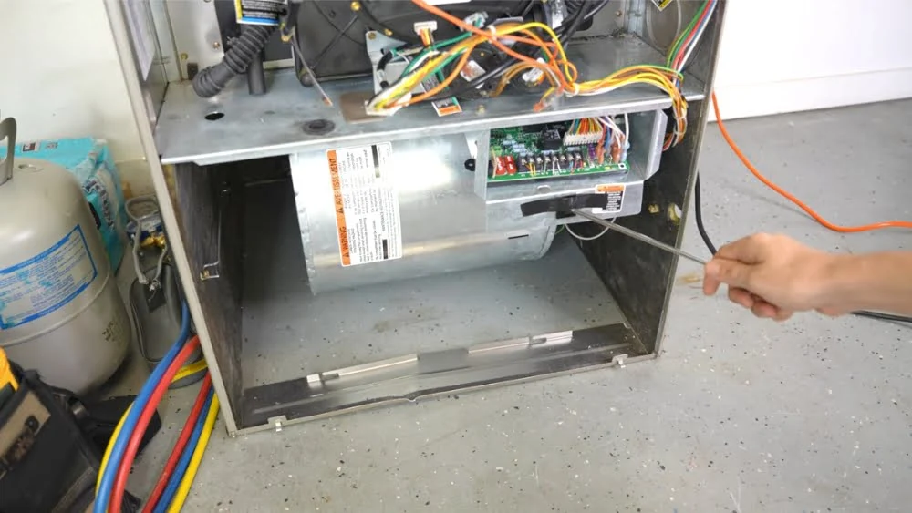 Open furnace cabinet showing ECM blower, control board, and wiring checked by a licensed HVAC contractor in Agoura Hills​.