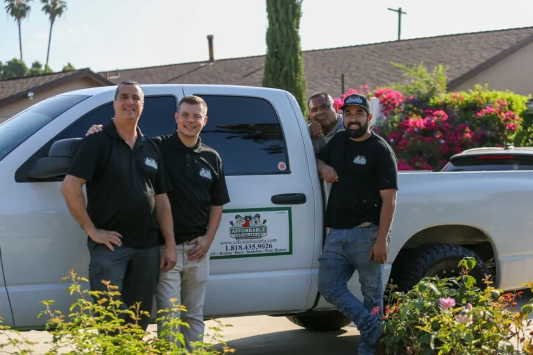 Affordable Heating and Air HVAC Contractor team in Los Angeles standing in front of their service truck.