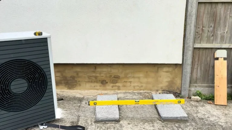 Concrete mounting pads being levelled before an electric heat pump installation in Thousand Oaks.