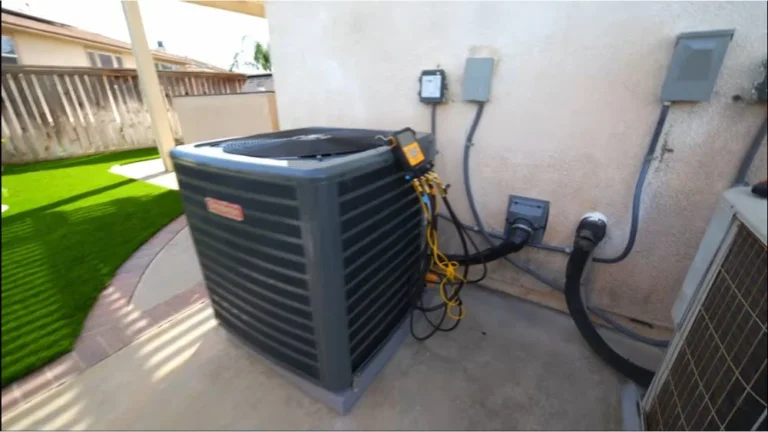 HVAC gauges and refrigerant lines connected to an outdoor unit during heat pump replacement work in Simi Valley.