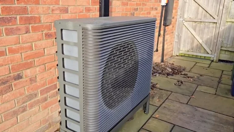 Newly installed outdoor heat pump beside a brick home following a heat pump replacement in Thousand Oaks, CA.