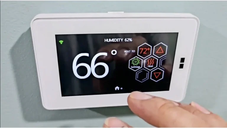Digital smart thermostat displaying 66 degrees current temperature, heat-to 72 degrees, and 62% humidity for a dual fuel system Thousand Oaks home.