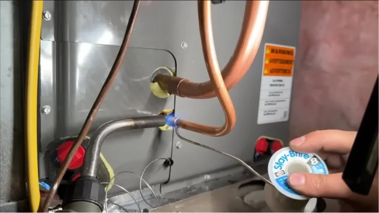 HVAC technician performing precision brazing on air conditioner copper refrigerant lines during AC Repair in Granada Hills.