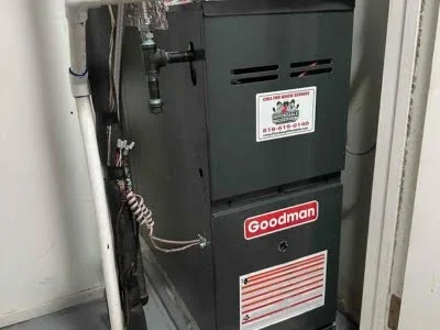 New Goodman gas furnace installed with venting and condensate line setup in Chatsworth CA by Affordable Heating and Air.