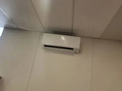 Wall-mounted ductless mini split AC indoor unit installation completed in Encino CA by Affordable Heating and Air.
