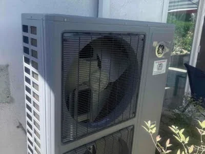 New outdoor air conditioning condenser installation in Reseda California home.